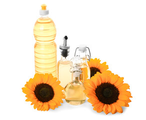 Bottles and decanter with sunflower oil on white background