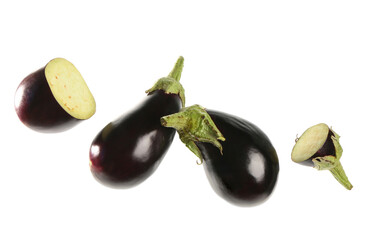 Flying fresh eggplants on white background