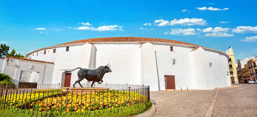 View of Plaza de Toros square, bullring arena, bronze sculpture in Ronda. Malaga province, Andalusia, Spain