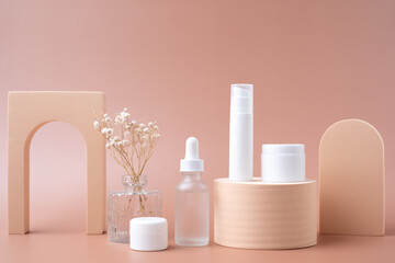 Cosmetic and skin care product mock upped on pastel background with decoration. Beauty and fashion background.