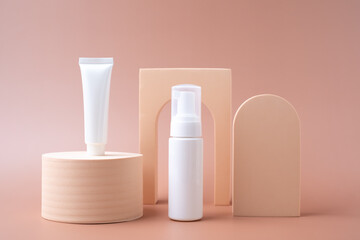 Mock-up pump, bottle, and tube for cosmetic and skin care products on a pastel background with minimal object design.