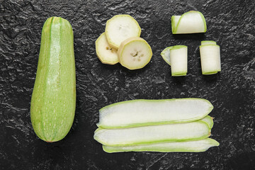 Fresh green with cut slices on black background