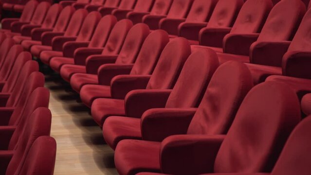 So many red empty cinema chairs