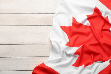 Flag of Canada on white wooden background