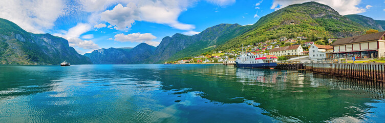 Panorama of Aurlandsfjord with view of town wharf. Sognefjord,  Norway