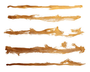 Grunge Gold ink color smear brush stroke stain line blot on white background.