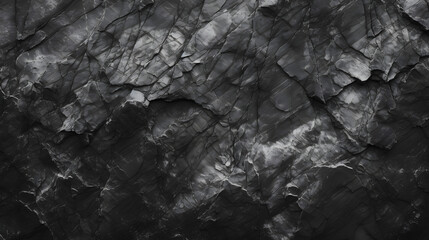 Black white rock texture. Dark gray stone granite background for design. Rough cracked mountain surface. Close-up. Crumbled. 
