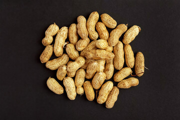 Roasted peanuts, peanuts in shell Isolated on black background