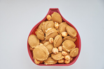 Apricot and cherry stones in plasma form on a white background. View from above. Vitamin B 17. Healthy food background.