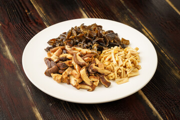 Various dried mountain delicacies on a monochrome background