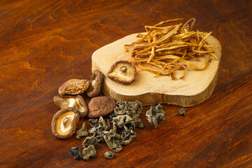Various dried mountain delicacies on a monochrome background