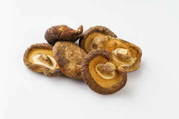 Dried shiitake mushrooms on a monochrome background