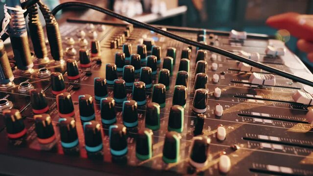 Audio mixer console knobs close up. Modern sound studio equipment.