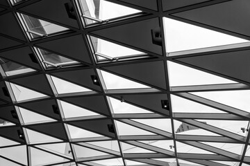 Black and white tone, Interior view of triangular pattern of aluminium cladding facade.   - Powered by Adobe