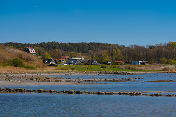 Row of exclusive homes near a beach.