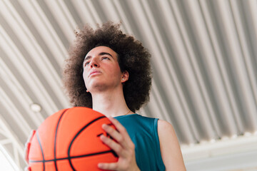Low angle portrait of a young basketball player