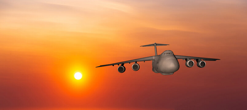 US Air Force military transport airplane on a sunset sky background