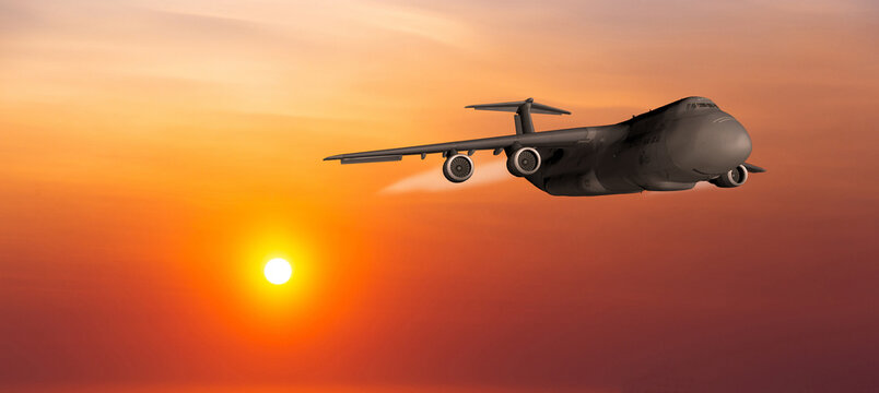 US Air Force military transport airplane on a sunset sky background