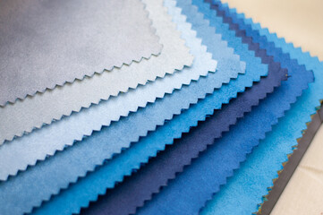 Samples of velvet tissue. Gray, blue and dark blue color options for velvet fabric