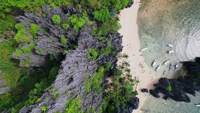 Drone footage. Aerial view of lagoon and bay as main subject in Philippines. 360 Rotation with a 90 degree view of beach and rocks.