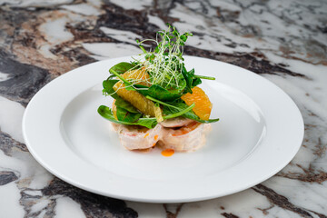 Lunch king prawns in cream sauce with oranges, spinach and microgreens.