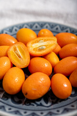 Delicious small citrus fruits orange kumquats close-up
