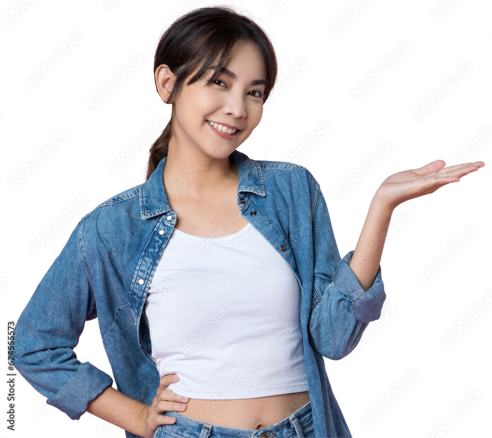 Wall mural young happy asian woman pointing showing hands up presentation to copy space she wearing jean shoot 