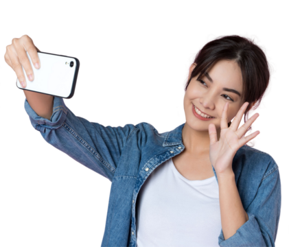 Young Asian woman taking selfie wiith smartphone shoot in isolated background.