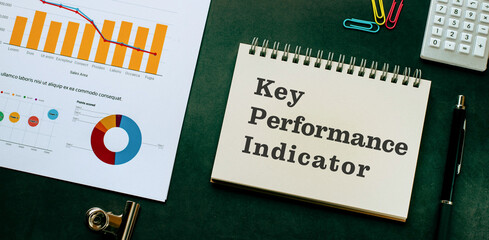 There is notebook with the word Key Performance Indicator. It is as an eye-catching image.