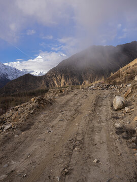 View of Mt Rakaposhi on a foggy morning from Aliabad, Hunza Valley, Gilgit Baltistan, Karakoram range of the Himalayas.
