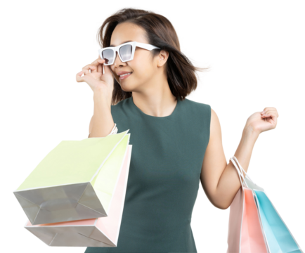 Young Asian woman carrying shopping bag and enjoy shopping studio shot on a white background.