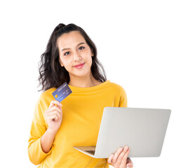 Young beauty Asian woman shopping payment online with credit card on laptop notebook and she wearing a yellow sweater and looking on camera shot isolated on white background