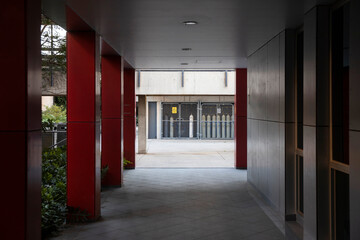 Empty university campus corridor with stored gas bottles.