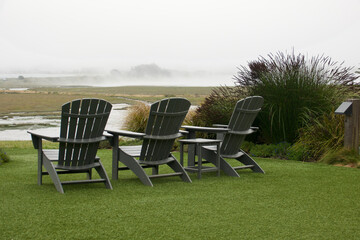 Adirondack chairs positioned to enjoy the bird sanctuary