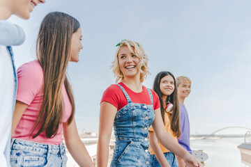 Group of smiling multiracial teenagers, happy friends talking, communication, walking on the...