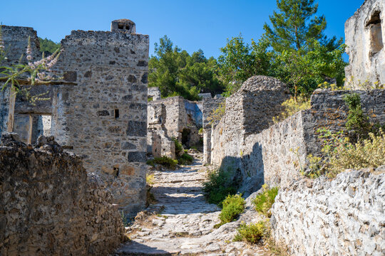 Stone street and Greek house ruins in the ghost town Kayakoy. Kayakoy is abandoned Greek village in Fethiye district, Turkey.