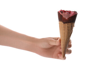 Woman holding delicious ice cream in waffle cone on white background, closeup