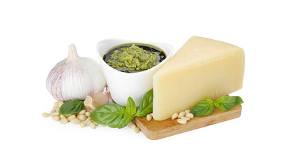 Tasty pesto sauce in bowl and ingredients on white background