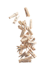 Wooden clothespins float gracefully in air, purposeful clips and holds transformed into a dance of household order and creative inspiration. Beige bundle of laundry dangles. White background isolated