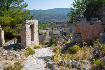 Fototapeta premium Stone street in the ghost town Kayakoy. Kayakoy is abandoned Greek village in Fethiye district, Turkey.