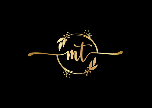 luxury gold signature initial mt logo design isolated leaf and flower