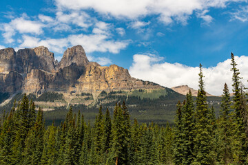 Summer time stunning views at Castle Mountain in Banff National Park with views along the turquoise Bow River in Alberta. Beautiful blue sky day with clouds. 