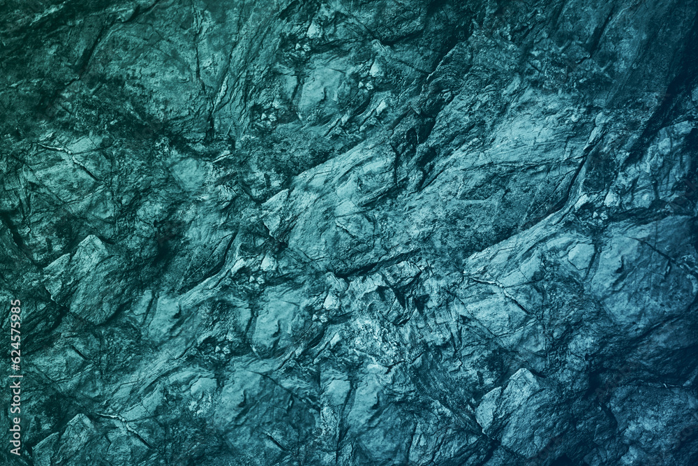 Wall mural Blue green gray teal aqua turquoise rough mountain surface. Close-up. Toned stone rock mineral granite texture background. Cracked, crumbled. Underwater, water or ice, frost effect.Color gradient.Dark