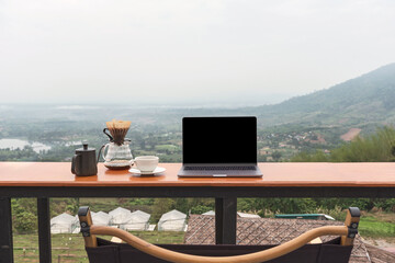I sat at the top of the mountain, working on my laptop with dripping coffee while admiring the...