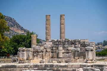 Fototapeta na wymiar Columns ruins of Leto Temple in Letoon ancient city. Letoon was the religious centre of Xanthos and the Lycian League.