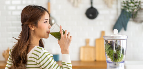 Portrait of beauty healthy asian woman making green vegetables detox cleanse and green fruit...