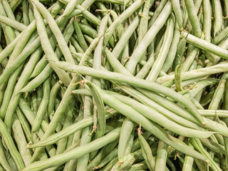 Organic Fresh raw string bean or french beans or buncis in Bahasa, as background, top view