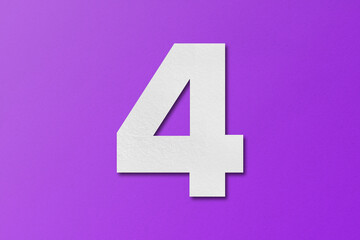 Fototapeta premium White paper type paper alphabet number 4 isolated on purple background.