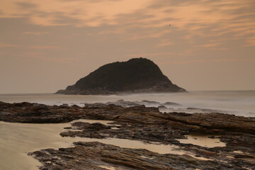 a beautiful view of an island at sunset