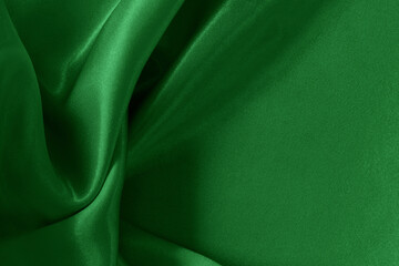 Green emerald fabric texture background, detail of silk or linen pattern.